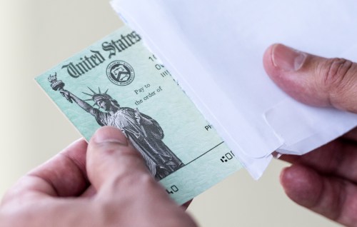 Men hands holding a US Government Treasury check