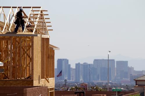 A carpenter works on a new home at a residential construction site in the west side of the Las Vegas Valley in Las Vegas, Nevada April 5, 2013.  Las Vegas Strip casinos are shown in the background. The buying of foreclosed homes and other distressed homes by three big institutional buyers is reshaping the housing market in Las Vegas.     REUTER/Steve Marcus (UNITED STATES - Tags: REAL ESTATE BUSINESS CONSTRUCTION) - TM4E94C0RVS01