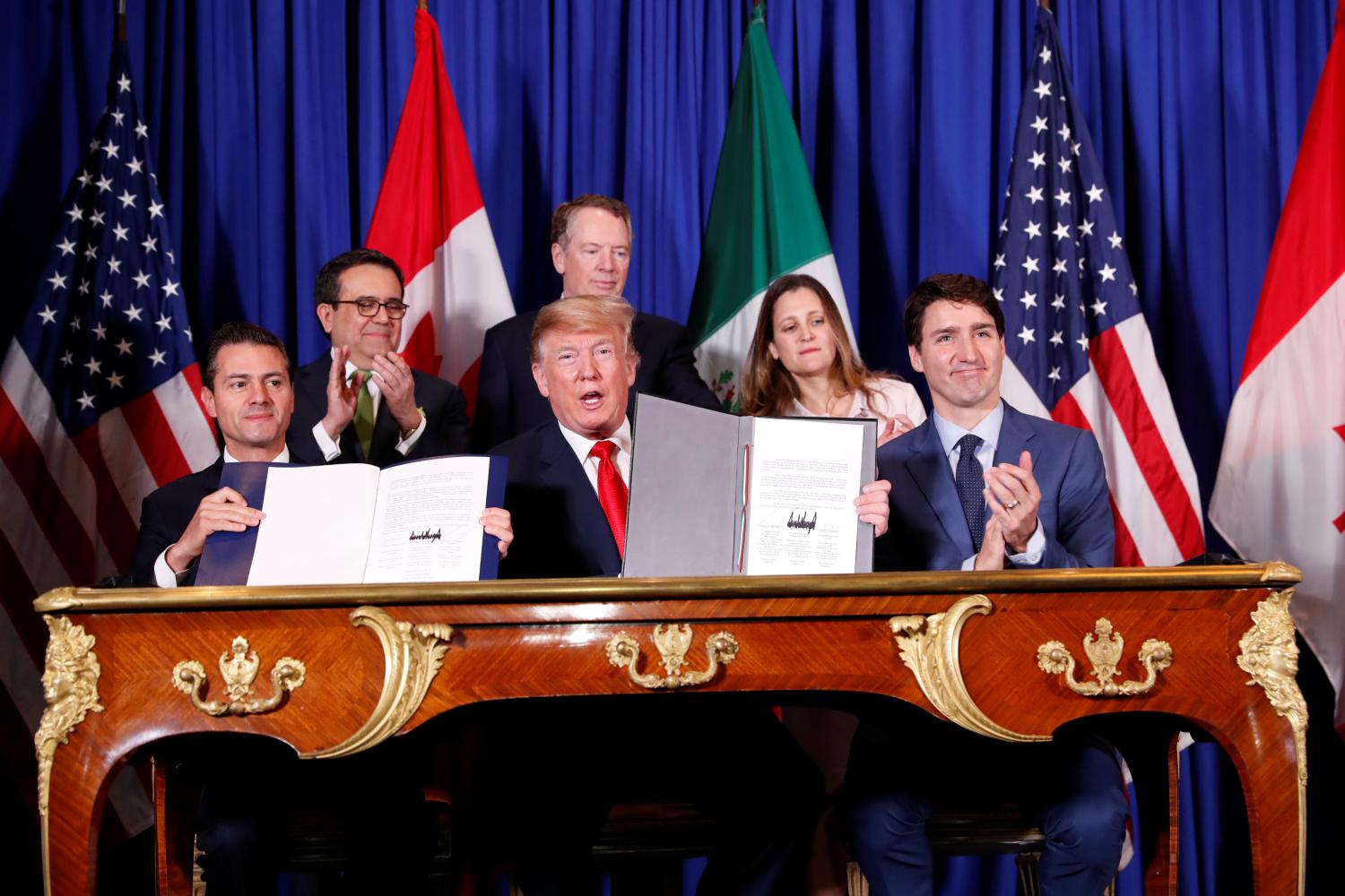 U.S. President Donald Trump, Canada's Prime Minister Justin Trudeau and Mexico's President Enrique Pena Nieto attend the USMCA signing ceremony before the G20 leaders summit in Buenos Aires, Argentina November 30, 2018. REUTERS/Kevin Lamarque - RC156BBD3810