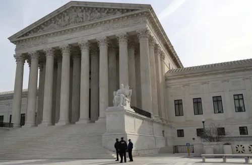 Security guards stand outside the U.S. Supreme Court building in Washington, U.S., March 20, 2019. REUTERS/Leah Millis - RC120F4804E0