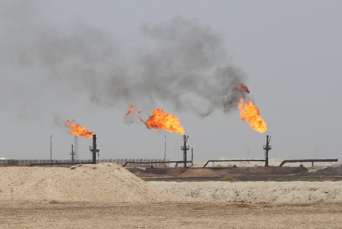 Flames emerge from the flare stacks at the West Qurna-1 oilfield, which is operated by Exxon Mobil, near Basra, Iraq, May 20, 2019. Picture taken May 20, 2019. REUTERS/Essam Al-Sudani - RC1D78173900