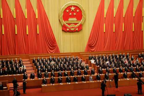Officials sing the national anthem at the closing session of the National People's Congress (NPC) at the Great Hall of the People in Beijing, China March 15, 2019.  REUTERS/Thomas Peter - RC17C6B7C7E0