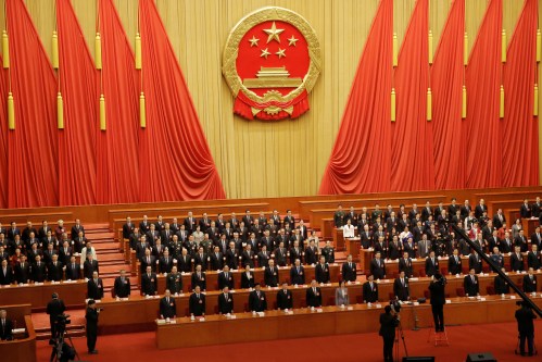 Officials sing the national anthem at the closing session of the National People's Congress (NPC) at the Great Hall of the People in Beijing, China March 15, 2019.  REUTERS/Thomas Peter - RC17C6B7C7E0