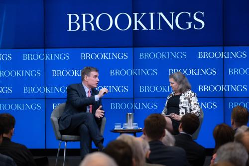 Sen. Mark Warner and Victoria Nuland speak at an event at Brookings.