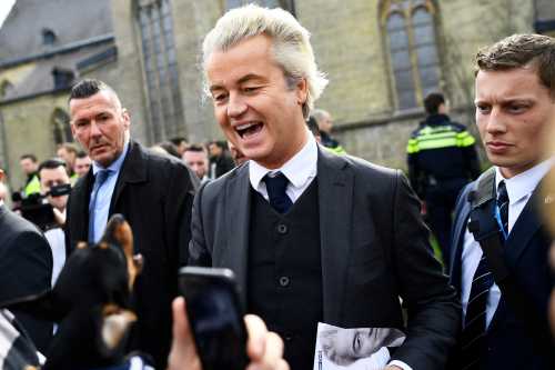 Dutch far-right politician Geert Wilders of the PVV party reacts as a dog barks at him as he campaigns in Valkenburg, Netherlands, March 11, 2017.  REUTERS/Dylan Martinez - RC1F934580E0