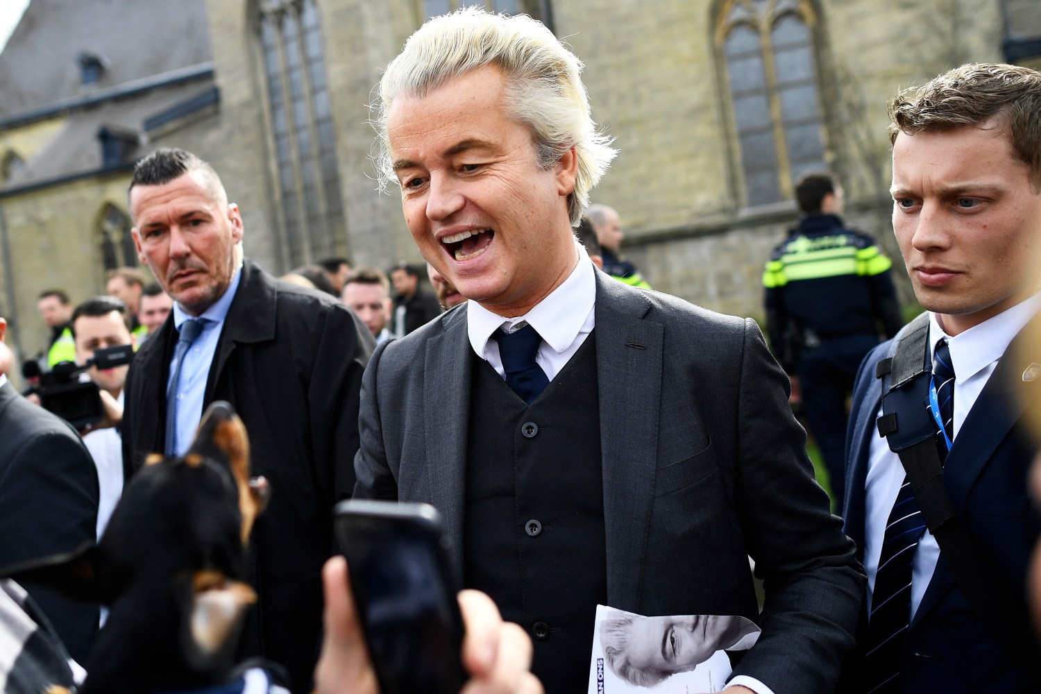 Dutch far-right politician Geert Wilders of the PVV party reacts as a dog barks at him as he campaigns in Valkenburg, Netherlands, March 11, 2017.  REUTERS/Dylan Martinez - RC1F934580E0