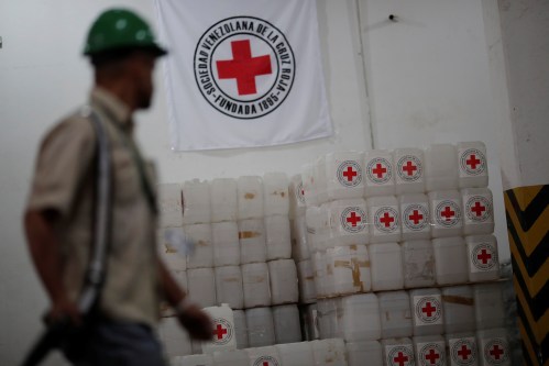 The logo of the International Federation of Red Cross is seen on boxes at the warehouse of Venezuelan Red Cross, where international humanitarian aid for Venezuela is being stored, in Caracas, Venezuela, April 22, 2019. REUTERS/Ueslei Marcelino - RC12F43CB840