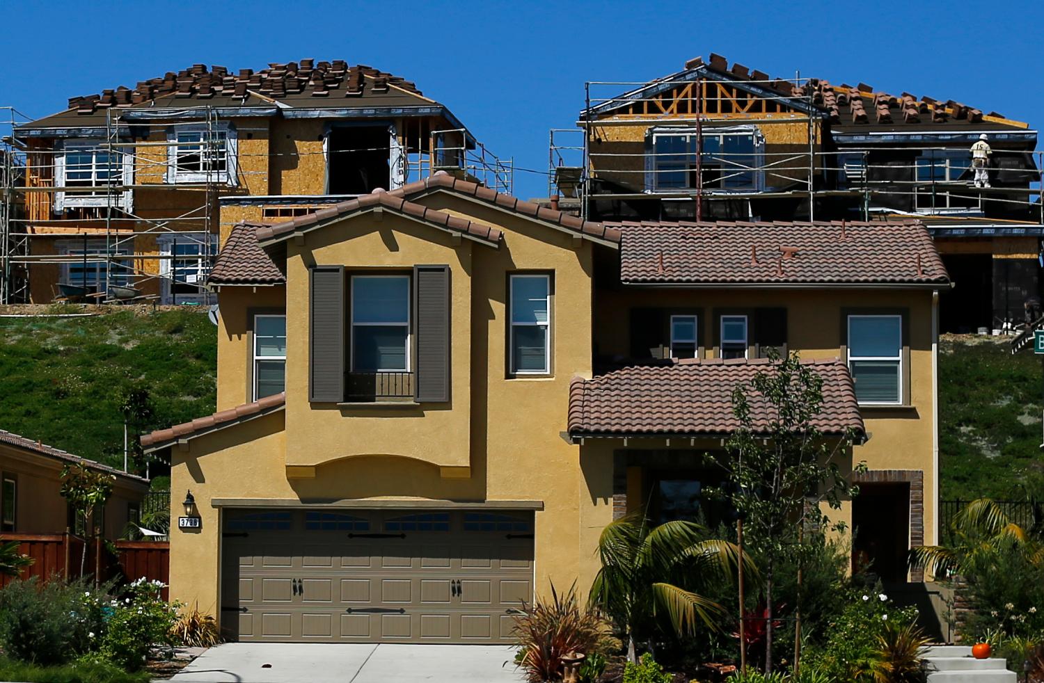 Scaffolding is seen at the construction site of a new home in Carlsbad, California September 22, 2014. U.S. manufacturing activity hovered at a near 4-1/2-year high in September and factory employment surged, supporting views of sturdy economic growth this quarter. The economic picture was further brightened by other data on Tuesday showing an acceleration in factory and services industry growth in some areas of the country. Housing, however, continues to plod along, with home price gains decelerating sharply in July. Picture taken September 22, 2014.     REUTERS/Mike Blake (UNITED STATES - Tags: BUSINESS CONSTRUCTION REAL ESTATE) - GF2EA9M1LYO01