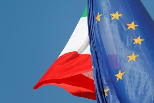 European Union and Italian flags are seen in downtown Rome, Italy, October 19, 2018.   REUTERS/Alessandro Bianchi - RC118853AF70