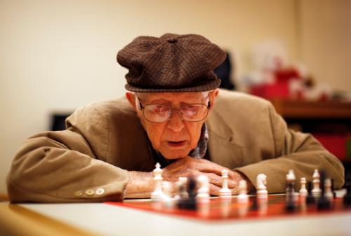 Earl Gilbert, 97, plays chess at Royal Oaks retirement community in Sun City, Arizona, January 8, 2013. Sun City was built in 1959 by entrepreneur Del Webb as America?s first active retirement community for the over-55's. Del Webb predicted that retirees would flock to a community where they were given more than just a house with a rocking chair in which to sit and wait to die. Today?s residents keep their minds and bodies active by socializing at over 120 clubs with activities such as square dancing, ceramics, roller skating, computers, cheerleading, racquetball and yoga. There are 38,500 residents in the community with an average age 72.4 years. Picture taken January 8, 2013. REUTERS/Lucy Nicholson (UNITED STATES - Tags: SOCIETY)ATTENTION EDITORS - PICTURE 9 OF 30 FOR PACKAGE 'THE SPORTY SENIORS OF SUN CITY'SEARCH 'SUN CITY' FOR ALL IMAGES - GM1E91H00JE01