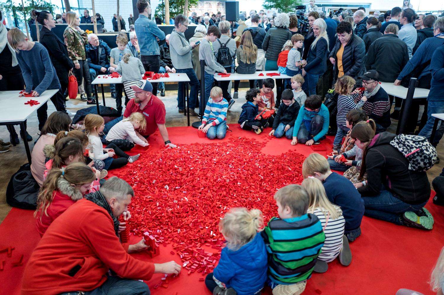 Adults and children play with Lego bricks during the celebrations of the 60th anniversary of the Lego brick, at Lego House in Billund, Denmark January 28, 2018. Scanpix Denmark/Michael Drost-Hansen via REUTERS ATTENTION EDITORS - THIS IMAGE WAS PROVIDED BY A THIRD PARTY. DENMARK OUT. NO COMMERCIAL OR EDITORIAL SALES IN DENMARK. - RC142CA74E00
