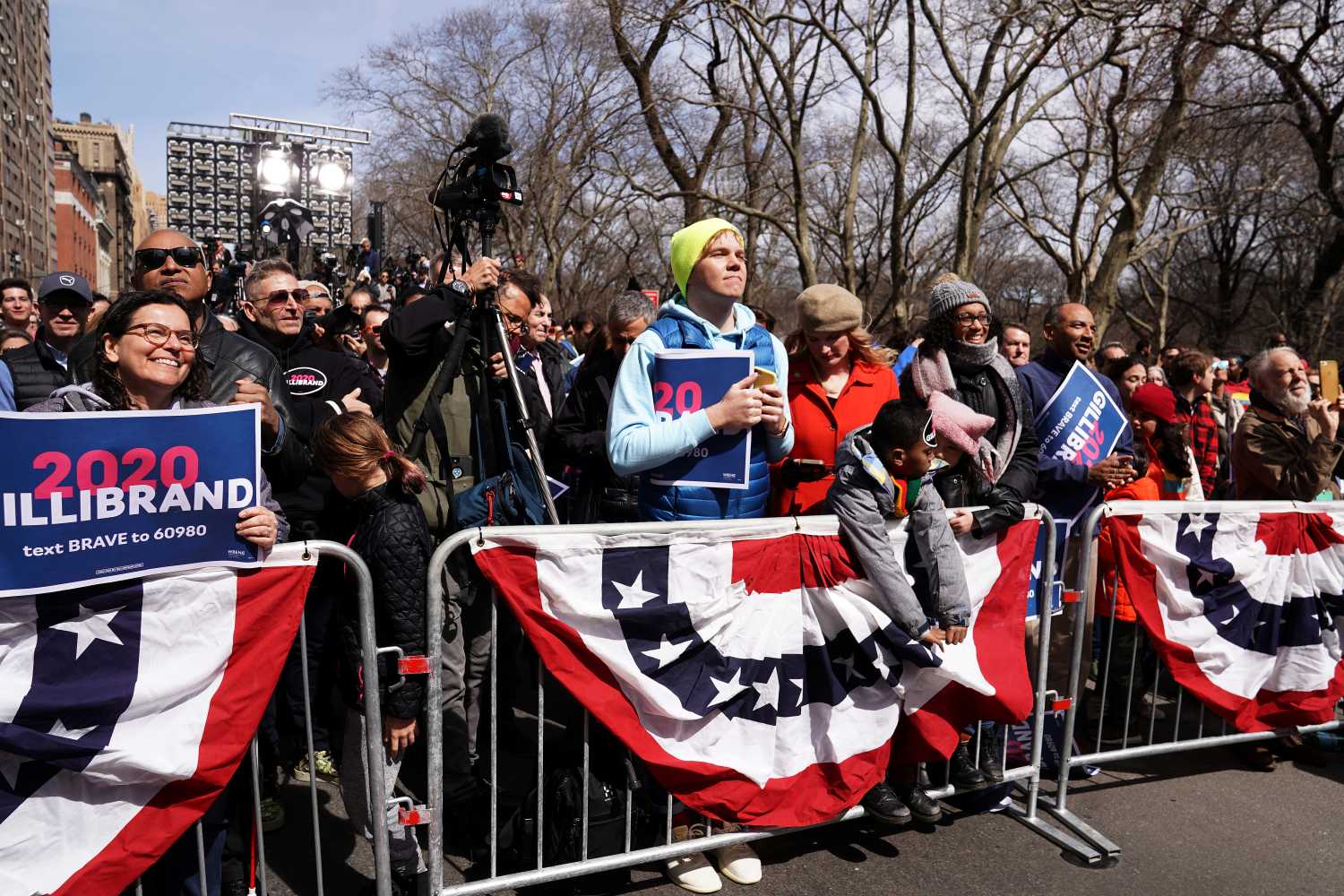 People watch Democratic 2020 U.S. presidential candidate and U.S. Senator Kirsten Gillibrand (D-NY) speak during her campaign kick off event in New York, New York, U.S., March 24, 2019.   REUTERS/Carlo Allegri - RC137D9D5970