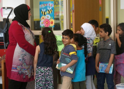 Students at Miller Elementary School stand in-line in the school library in Dearborn, Michigan, U.S. May 6, 2019.  REUTERS/Rebecca Cook - RC13710DD620