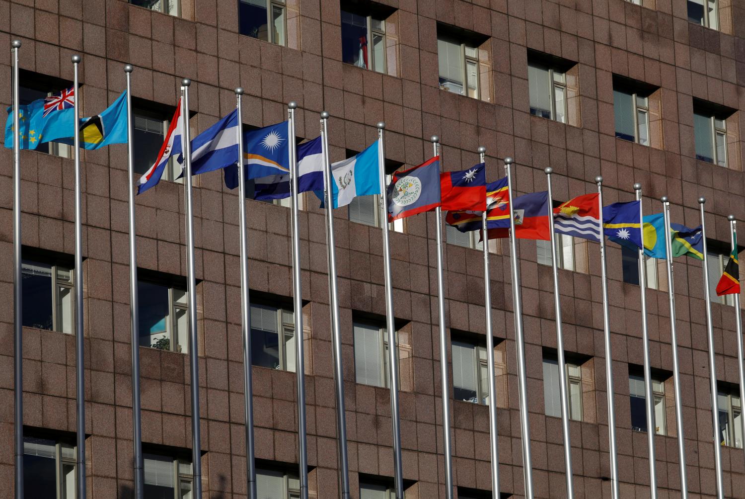 Flagpoles of the national flags are seen inside the Diplomatic Quarter, where Taiwan ally embassies located, in Taipei, Taiwan August 23, 2018.  REUTERS/Tyrone Siu - RC1D8DA29900