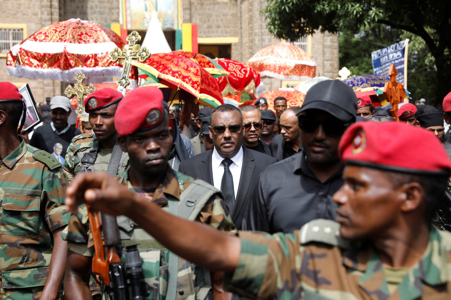 Ethiopia's deputy prime minister Demeke Mekonnen (C) attends the funeral of Amhara president Ambachew Mekonnen and two other officials who where killed in an attack in the town of Bahir Dar, Amhara region, Ethiopia June 26, 2019. Picture taken June 26, 2019. REUTERS/Baz Ratner To match Insight ETHIOPIA-SECURITY/ATTACKS - RC1E3C93C210