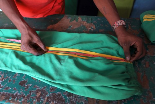 A manufacturer, works on sportswear in Adjame, Abidjan, Ivory Coast, May 16, 2019. REUTERS/Thierry Gouegnon - RC1BDE579120