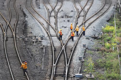 Workers inspect railway tracks, which serve as a part of the Belt and Road freight rail route linking Chongqing to Duisburg, at Dazhou railway station in Sichuan province, China March 14, 2019. Picture taken March 14, 2019.  REUTERS/Stringer ATTENTION EDITORS - THIS IMAGE WAS PROVIDED BY A THIRD PARTY. CHINA OUT. - RC1563D032A0