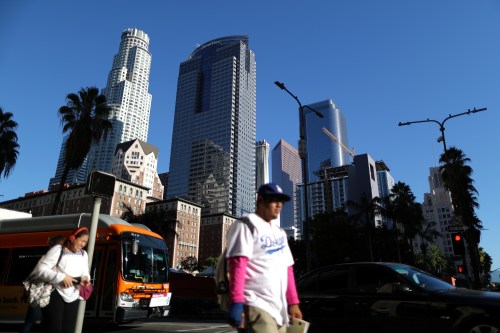 People walk in downtown Los Angeles, California, United States, October 17, 2018. REUTERS/Lucy Nicholson - RC1688DDCC30