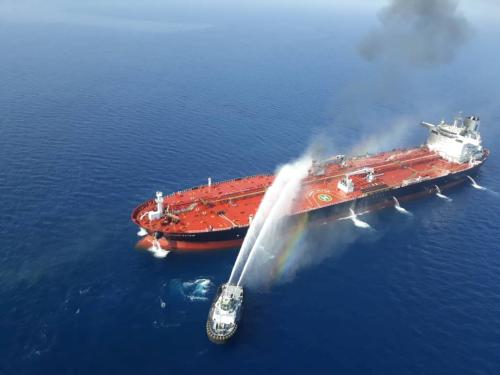 An Iranian navy boat tries to stop the fire of an oil tanker after it was attacked in the Gulf of Oman, June 13, 2019. Tasnim News Agency/Handout via REUTERS ATTENTION EDITORS - THIS IMAGE WAS PROVIDED BY A THIRD PARTY. - RC1D5E81AD00