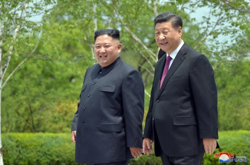 Chinese President Xi Jinping and North Korean leader Kim Jong Un walk during Xi's visit in Pyongyang, North Korea in this picture released by by North Korea's Korean Central News Agency (KCNA) on June 21, 2019.    KCNA via REUTERS    ATTENTION EDITORS - THIS IMAGE WAS PROVIDED BY A THIRD PARTY. REUTERS IS UNABLE TO INDEPENDENTLY VERIFY THIS IMAGE. NO THIRD PARTY SALES. SOUTH KOREA OUT. NO COMMERCIAL OR EDITORIAL SALES IN SOUTH KOREA. - RC1347120C00