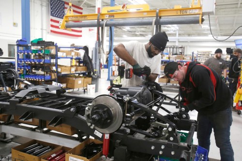 Mahindra Automotive North America assembly workers DeAndre Hall (L) and Ryan Hart work on the chassis for a ROXOR off-road vehicle at the MANA assembly plant in Auburn Hills, Michigan, U.S., January 30, 2019.  Photo taken January 30, 2019.    REUTERS/Rebecca Cook - RC145CDD5E30
