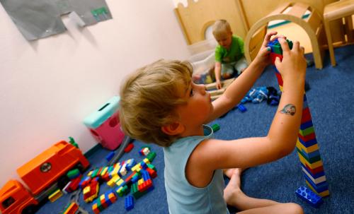 A four year-old boy plays at the Kathinka-Platzhoff-Stiftung Kindergarten (Kathinka-Platzhoff-foundation kindergarden) in Hanau, 30km (18 miles) south of Frankfurt, July 16, 2013. From August 1, 2013, all children in Germany between the age of 1 and 3 will have a legal entitlement to a place at a kindergarten. The Kindergarten of the Kathinka-Platzhoff-Stiftung is one of few which hosts children between the age of six month and six years.  Picture taken July 16. REUTERS/Kai Pfaffenbach (GERMANY - Tags: POLITICS BUSINESS EMPLOYMENT SOCIETY EDUCATION) - BM2E97G14ZD01