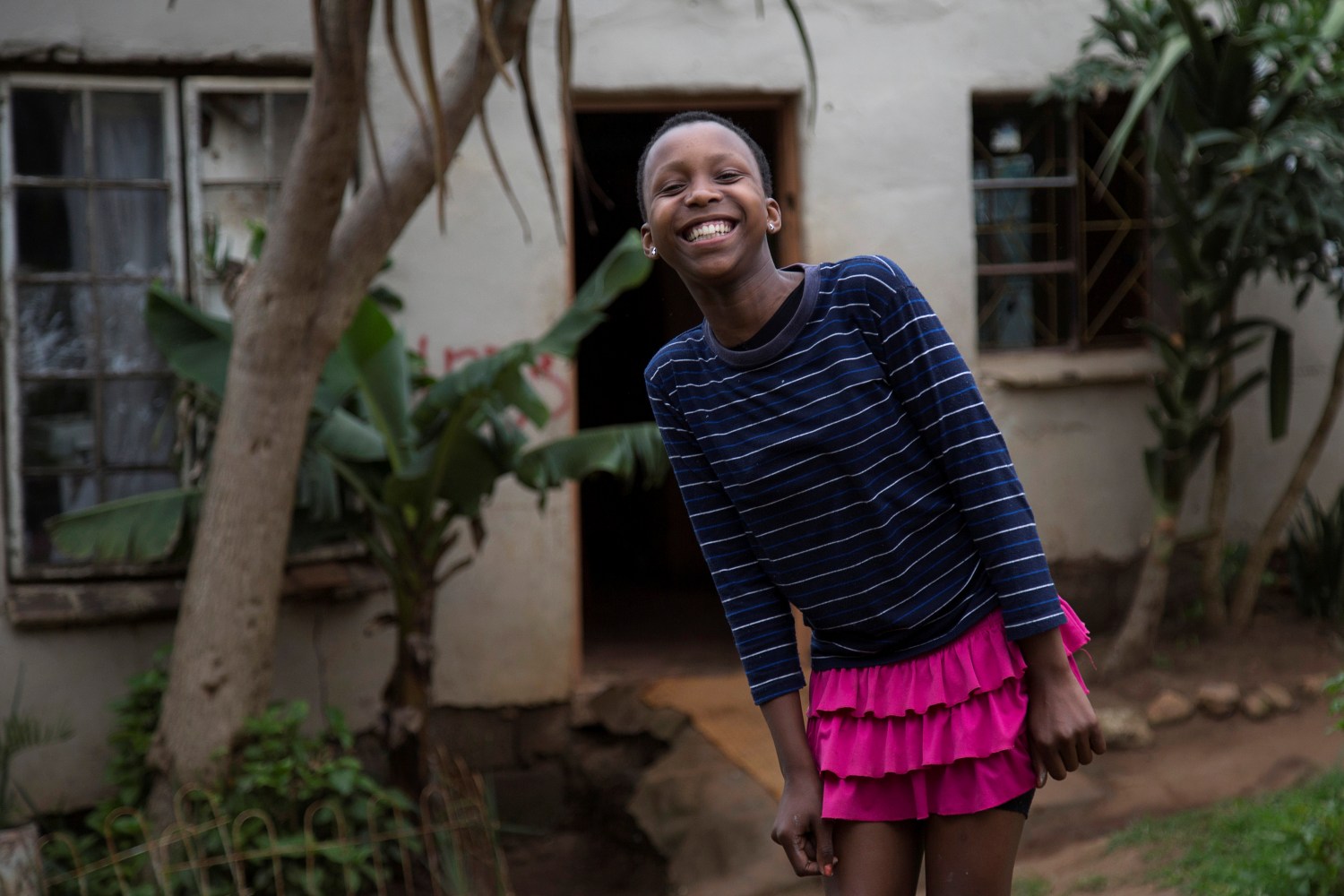 Khanyo Mchunu, 13, posing for a photograph in front of her house in Embo, South Africa, November 30, 2016. REUTERS/Rogan Ward       SEARCH "CHRISTMAS WISHES" FOR THIS STORY. SEARCH "WIDER IMAGE" FOR ALL STORIES. - RC13B192B6E0
