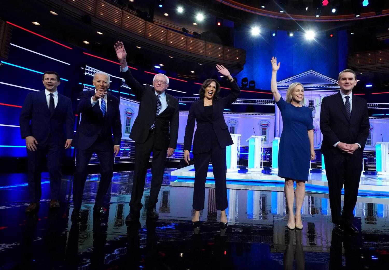 Democratic U.S. 2020 election presidential candidates including South Bend Mayor Pete Buttigieg, former Vice President Joe Biden, Senator Bernie Sanders, Senator Kamala Harris, Senator Kirsten Gillibrand and Senator Michael Bennet pose for pictures at the second U.S. 2020 presidential election Democratic candidates debate in Miami, Florida, U.S., June 27, 2019. REUTERS/Carlo Allegri     TPX IMAGES OF THE DAY - HP1EF6S071SK2