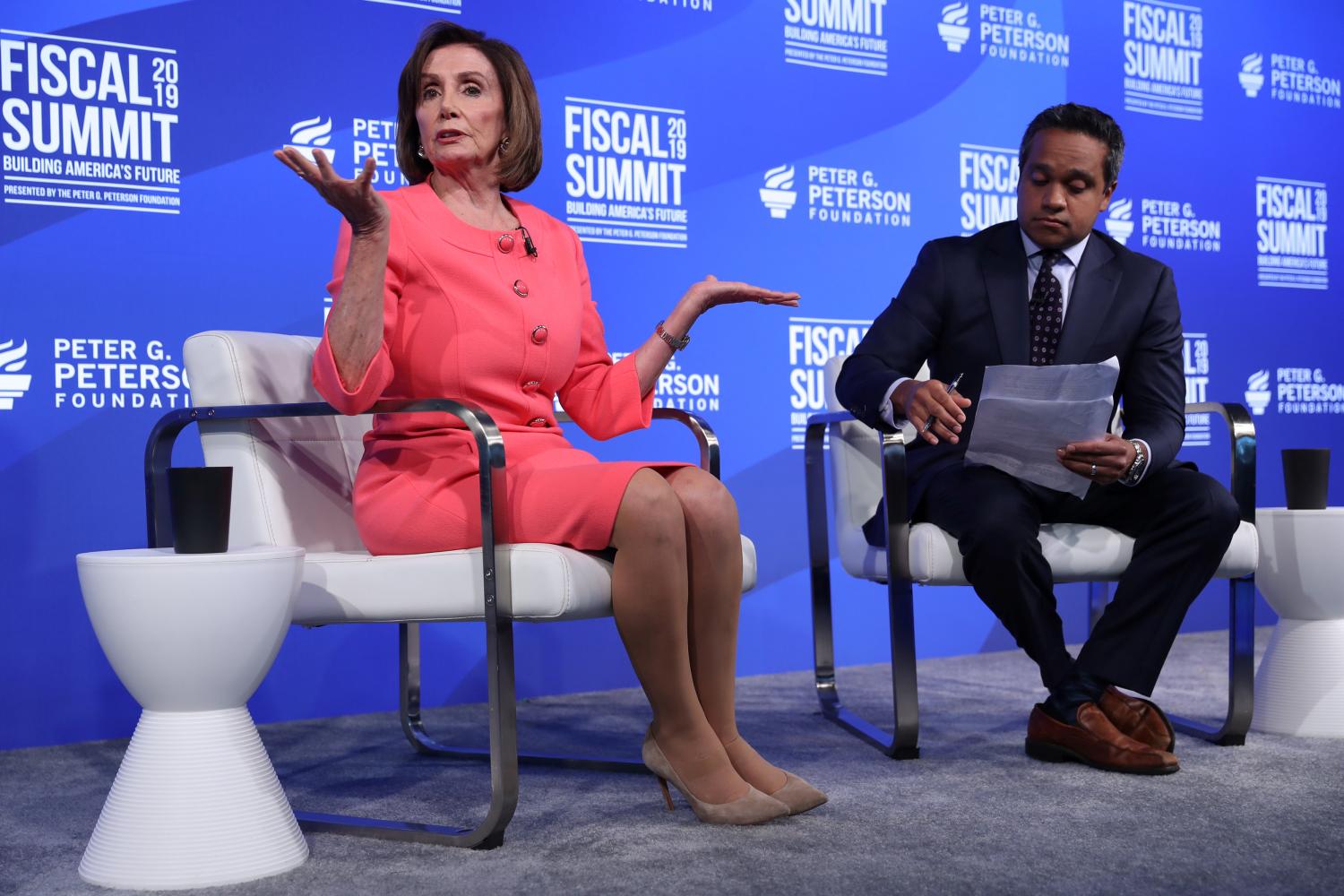 U.S. House Speaker Nancy Pelosi (D-CA) sits for an onstage interview about the U.S. budget with CNN reporter Manu Raju at the Peterson Foundation's annual Fiscal Summit in Washington, U.S. June 11, 2019.  REUTERS/Jonathan Ernst - RC19F3443080