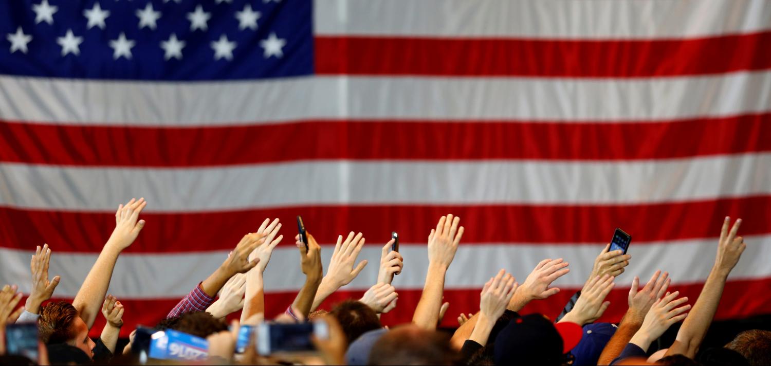 Supporters wave their hands in unison as they gather at a rally for U.S. Democratic presidential candidate Bernie Sanders in Anaheim, California, U.S., May 24, 2016. REUTERS/Mike Blake  - D1AETFXPDRAB