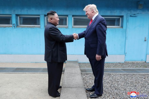 U.S. President Donald Trump shakes hands with North Korean leader Kim Jong Un as they meet at the demilitarized zone separating the two Koreas, in Panmunjom, South Korea, June 30, 2019. KCNA via REUTERS    ATTENTION EDITORS - THIS IMAGE WAS PROVIDED BY A THIRD PARTY. REUTERS IS UNABLE TO INDEPENDENTLY VERIFY THIS IMAGE. NO THIRD PARTY SALES. SOUTH KOREA OUT. NO COMMERCIAL OR EDITORIAL SALES IN SOUTH KOREA. - RC17C5D89720