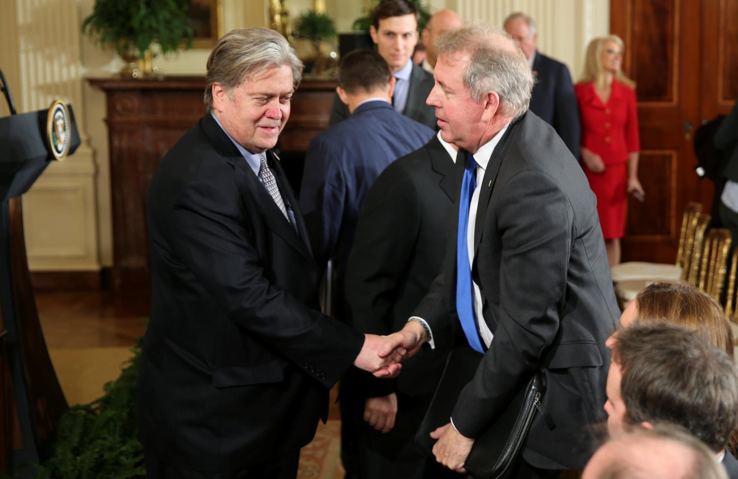 Then White House Chief Strategist Steve Bannon greets Britain's ambassador to the United States Kim Darroch prior to a joint news conference between U.S. President Donald Trump and British Prime Minister Theresa May at the White House in Washington, U.S., January 27, 2017.  Picture taken January 27, 2017. REUTERS/Carlos Barria - RC1965E5B780