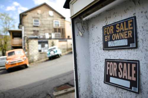 A tanning salon sits vacant, out of business and for sale in Shamokin May 1, 2014. Shamokin, Pennsylvania, tucked away in the coal country about 120 miles northwest of Philadelphia, has $800,000 of unpaid bills and can't get a loan from a bank. It is so broke, the gas service to city hall was temporarily cut off last month. So the council for the city of 7,000 residents has agreed to seek entry to a state financial oversight program dating from 1987 that facilitates access to credit and permits the levying of certain taxes. Picture taken May 1, 2014.  To match Story USA-PENNSYLVANIA/MUNICIPALS       REUTERS/Mark Makela  (UNITED STATES - Tags: BUSINESS POLITICS SOCIETY) - GM1EA5217EX01