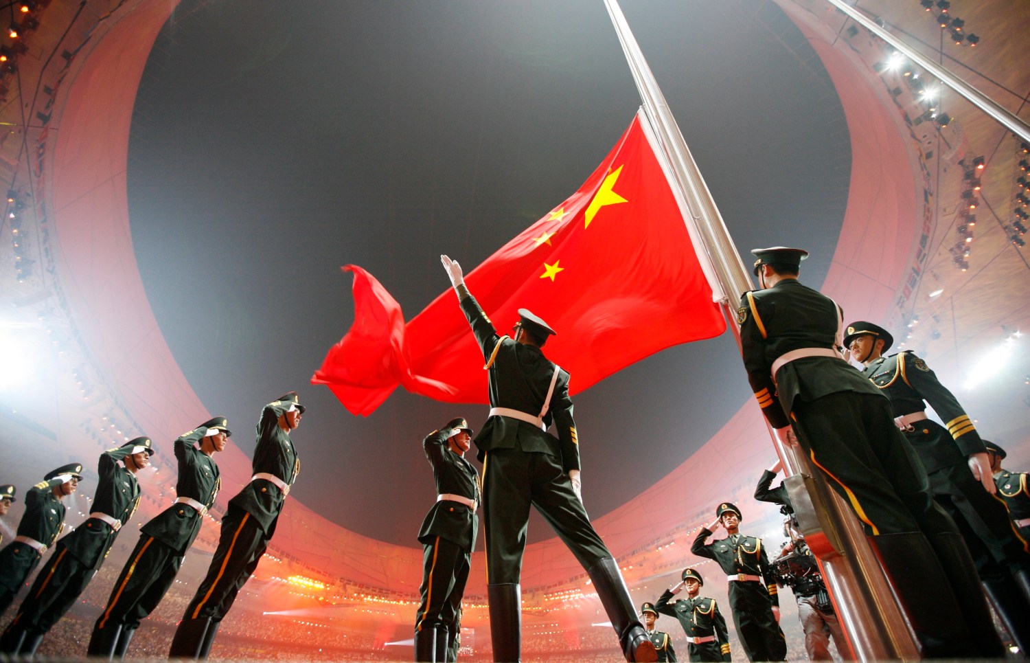 China's national flag is raised during the opening ceremony of the Beijing 2008 Olympic Games at the National Stadium in this August 8, 2008 file photo. REUTERS/Jerry Lampen/Files (CHINA - Tags: SPORT TPX IMAGES OF THE DAY)ATTENTION EDITORS - THIS PICTURE IS PART OF PACKAGE '30 YEARS OF REUTERS PICTURES'TO FIND ALL 56 IMAGES SEARCH '30 YEARS' - LM2EB2A0WH901