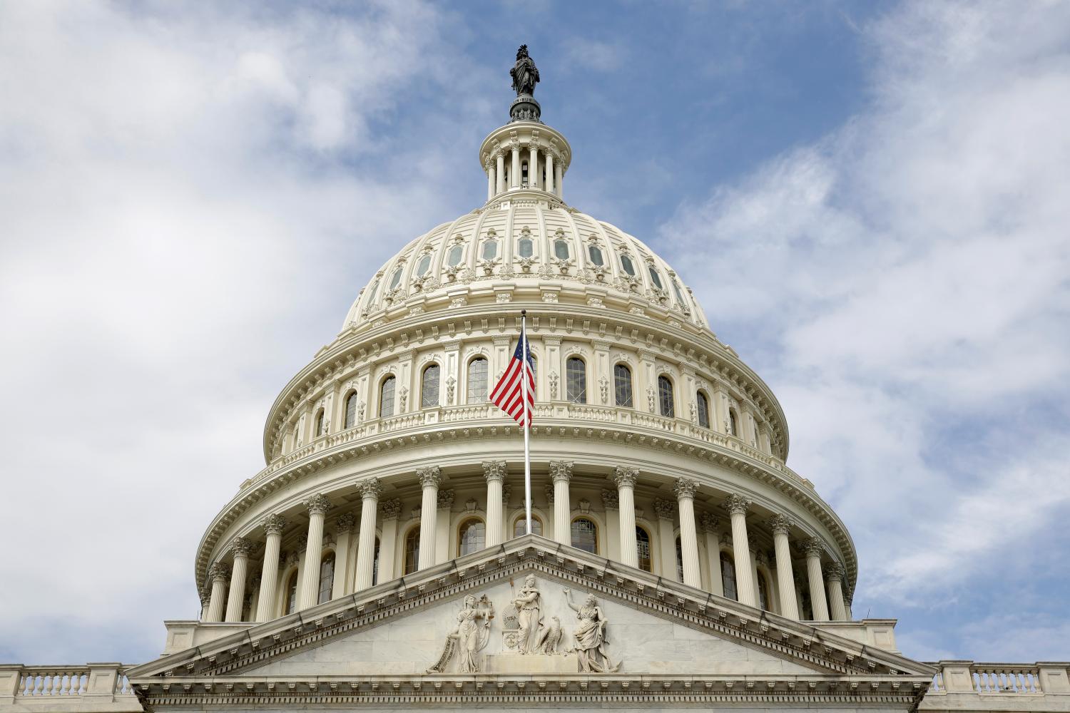 The U.S. flag flies in front of the Capitol Dome at the U.S. Capitol in Washington, U.S., September 12, 2017.   REUTERS/Joshua Roberts - RC12EA411BD0