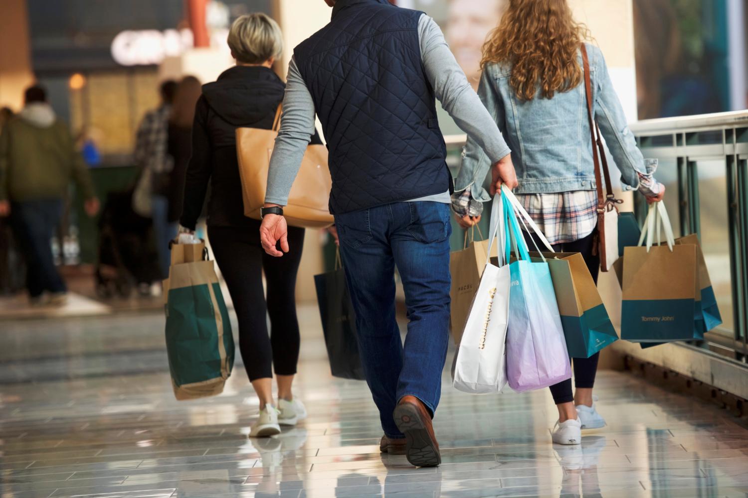 Shoppers carry bags of purchased merchandise at the King of Prussia Mall, United States' largest retail shopping space, in King of Prussia, Pennsylvania, U.S., December 8, 2018.  REUTERS/Mark Makela - RC19C3DD4450