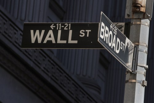 Street signs for Broad St. and Wall St. are seen outside of the New York Stock Exchange (NYSE) in New York, U.S., March 7, 2019. REUTERS/Brendan McDermid - RC1759731F20