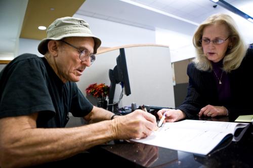 California state worker Albert Jagow (L) goes over his retirement options with Calpers Retirement Program Specialist JeanAnn Kirkpatrick at the Calpers regional office in Sacramento, California October 21, 2009. Calpers, the largest U.S. public pension fund, manages retirement benefits for more than 1.6 million people, with assets comparable in value to the entire GDP of Israel. The Calpers investment portfolio had a historic drop in value, going from a peak of $250 billion in the fall of 2007 to $167 billion in March 2009, a loss of about a third during that period. It is now around $200 billion. REUTERS/Max Whittaker   (UNITED STATES) - WASE5AM11ZS01