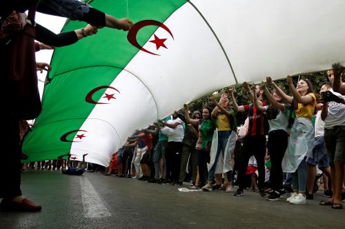 Demonstrators hold a national flag during a protest demanding the removal of the ruling elite in Algiers, Algeria July 12, 2019. REUTERS/Ramzi Boudina - RC123B9B63D0