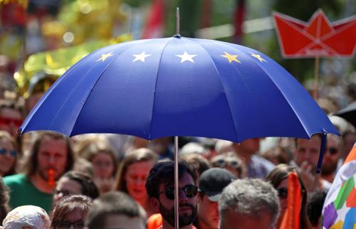 A man carries an EU flag design umbrella as he takes part in the demonstration "One Europe for all", a rally against nationalism across the European Union, in Vienna, Austria, May 19, 2019. REUTERS/Lisi Niesner - RC19C24D3EB0