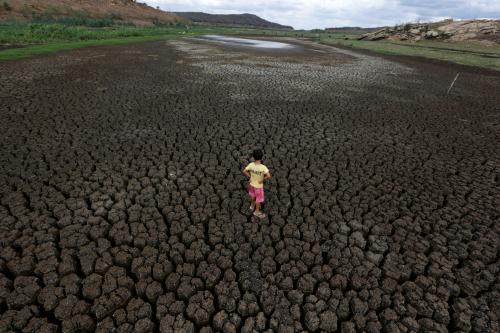 Natan Cabral, 5, stands on the cracked ground of the Boqueirao reservoir in the Metropolitan Region of Campina Grande, Paraiba state, Brazil, February 13, 2017. REUTERS/Ueslei Marcelino             SEARCH "BRAZIL DROUGHT" FOR THIS STORY. SEARCH "WIDER IMAGE" FOR ALL STORIES. - RC1BC8B7DB20