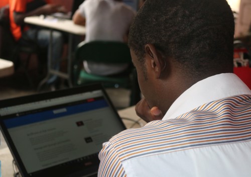 Young startup promoters work on their computers in New Bonako village, Cameroon March 28, 2017 2017. Picture taken March 28, 2017. REUTERS/Stringer - RC169F5B0CF0