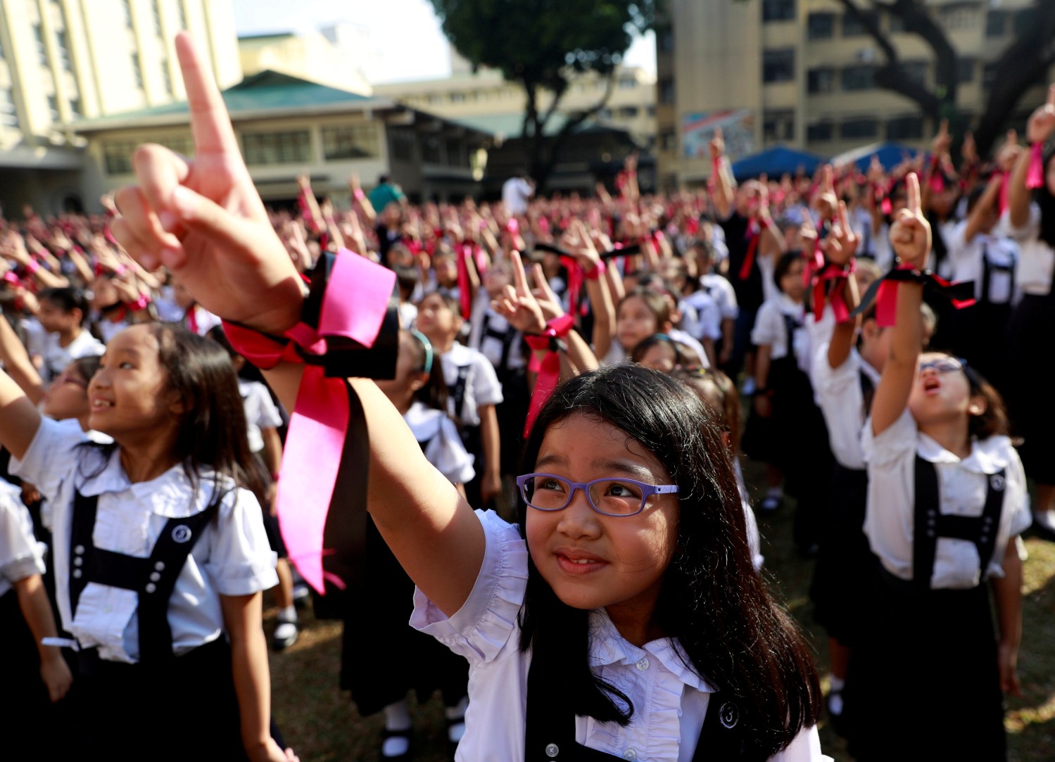 Filipino students dance to take part in the One Billion Rising global campaign to end violence against women and children, during the Valentine's Day celebration at St Scholastica's College in Manila, Philippines, February 14, 2019. REUTERS/Eloisa Lopez     TPX IMAGES OF THE DAY - RC1BB6610190