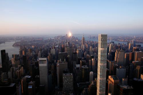 The rising sun reflects off of One World Trade at the southern tip of the Manhattan borough of New York, U.S., November 2, 2016. REUTERS/Lucas Jackson  - D1BEUKNTPYAB