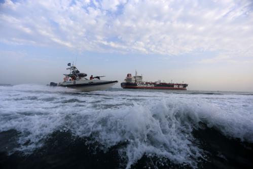 A boat of the Iranian Revolutionary Guard sails close to Stena Impero, a British-flagged vessel owned by Stena Bulk, near Bandar Abbas port, Iran July 21, 2019. Picture taken July 21, 2019. Fars News Agency/ WANA Handout via REUTERS ATTENTION EDITORS - THIS IMAGE WAS PROVIDED BY A THIRD PARTY. - RC1D73A09A90