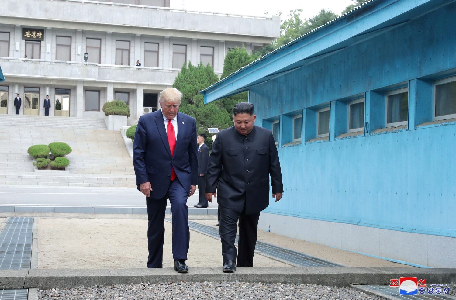 U.S. President Donald Trump and North Korean leader Kim Jong Un cross over a military demarcation line at the demilitarized zone (DMZ) separating the two Koreas, in Panmunjom, South Korea, June 30, 2019. KCNA via REUTERS    ATTENTION EDITORS - THIS IMAGE WAS PROVIDED BY A THIRD PARTY. REUTERS IS UNABLE TO INDEPENDENTLY VERIFY THIS IMAGE. NO THIRD PARTY SALES. SOUTH KOREA OUT. NO COMMERCIAL OR EDITORIAL SALES IN SOUTH KOREA. - RC1D4113FE00
