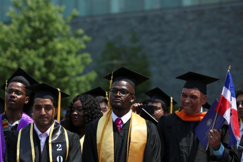 Graduates of The City College of New York stand at their commencement ceremony in Manhattan on May 31, 2019. REUTERS/Gabriela Bhaskar - RC1BEA7E4900