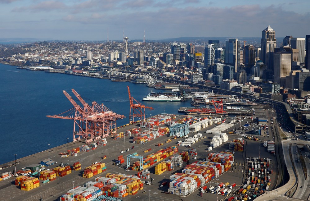 An aerial photo looking north shows shipping containers at the Port of Seattle and the Elliott Bay waterfront in Seattle, Washington, U.S. March 21, 2019. Picture taken March 21, 2019.    REUTERS/Lindsey Wasson - RC1E4C4C0450