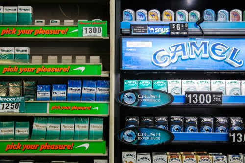 Newport and Camel cigarettes are stacked on a shelf inside a tobacco store in New York July 11, 2014. U.S. cigarette maker Reynolds American Inc is in talks to acquire rival Lorillard Inc in a multi-billion dollar deal that would reshape one of the world's biggest and most profitable tobacco markets, the companies said on Friday. In a statement confirming what people familiar with the matter previously told Reuters, Reynolds, No.2 player in the United States with brands including Camel and Pall Mall, said the talks were consistent with its strategy of weighing options that would help boost shareholder value. Buying Lorillard, which had a stock market value of $22.9 billion on Thursday, would give Reynolds the leading U.S. menthol cigarette Newport and its leading e-cigarette blu.Buying Lorillard, which had a stock market value of $22.9 billion on Thursday, would give Reynolds the leading U.S. menthol cigarette Newport and its leading e-cigarette blu. REUTERS/Lucas Jackson (UNITED STATES - Tags: BUSINESS) - GM1EA7C02A001