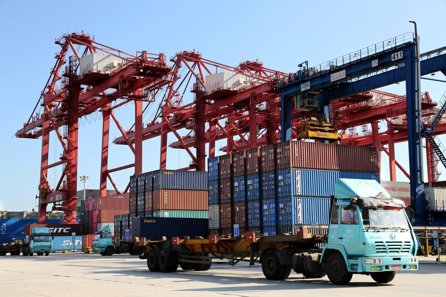 Shipping containers are seen at a port.